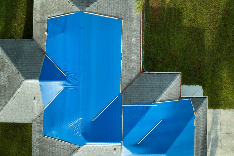 How to Tarp a Damaged Roof (Safely and Effectively)